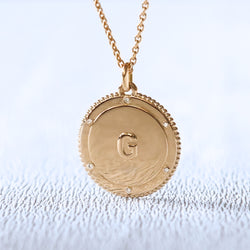 Médaille naissance personnalisée en or et diamants | Deloison Paris